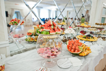 Dessert table of delicious fruits on wedding reception.