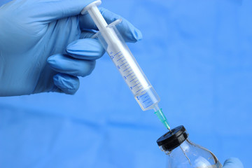 Gloves and syringe isolated on white. Healthcare And Medical concept.