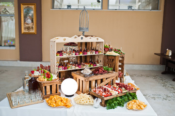 Dessert table of delicious snacks on wedding reception.