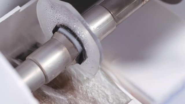 Manufacturing lens for glasses. Cutting lens with automatic machine