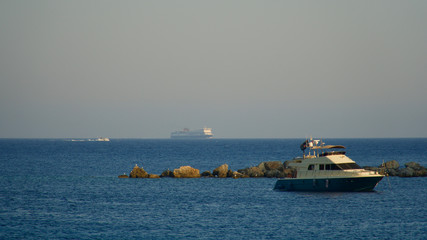 luxury private motor yacht anchored in the evening