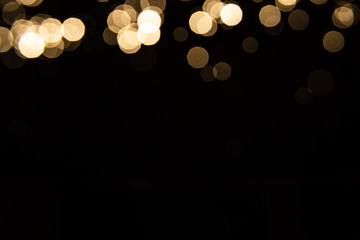Abstract gold bokeh with black background