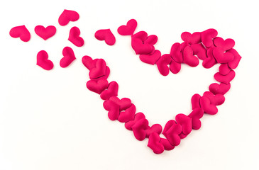 Obraz premium Valentines Day Heart Made of Red little cloth material hearts Isolated on White Background. Big Red Love Heart / seamless close up gift card / wedding