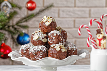 Chocolate Coconut Almond Balls on a cake stand