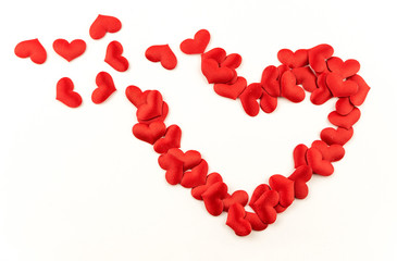 Valentines Day Heart Made of Red little cloth material hearts Isolated on White Background. Big Red Love Heart / seamless close up gift card / wedding