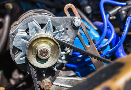 Blackpool, England 29/10/19 Close up Belt of car with shiny new bolts and nuts as well as runners. Alternator in the engine bay of a vehicle that has been renovated and looked after very well