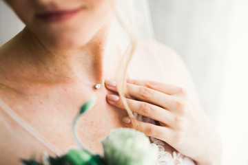 Portrait of stunning bride with long hair posing with great bouquet