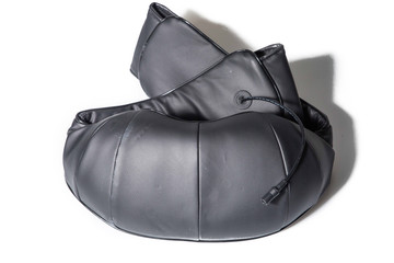 Naklejka premium Manchester, England, 12/11/19 Naipo Neck back shoulder electric massager machine in black with options for heated pads. Uses wire plugged into mains shot on a studio white isolated background