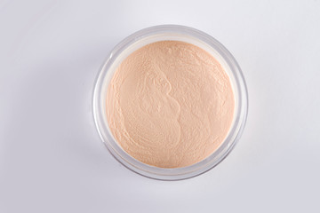 jar of face powder. Professional cosmetics. Loose powder. Tools make-up artist. Natural beige color.