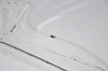 The snow tractor working on the snowy land of Jungfraujoch.