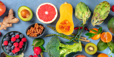 Vegan food panorama. Healthy diet concept. Fruits, vegetables, nuts, shot from above. A flat lay
