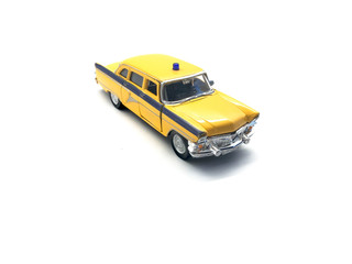 Toy car isolated on a white background. Yellow car for children. Vintage metal car.