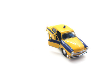 Toy car isolated on a white background. Yellow car for children. Vintage metal car.