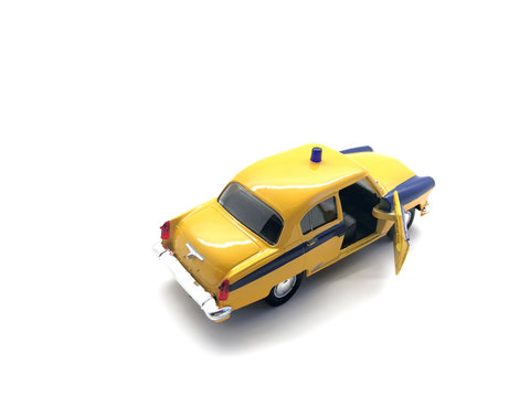 Toy car isolated on a white background. Yellow car for children. Vintage metal car. © serega_100500