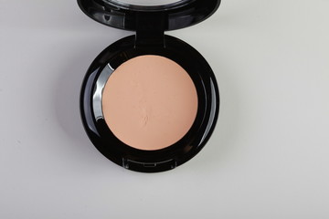 tonal basis. decorative cosmetics nude on dark background top view
