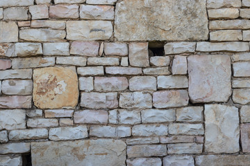 Stunning brick wall of Jerusalem stones in the beautiful garden near Herzl's cemetery. Jerusalem, Israel.