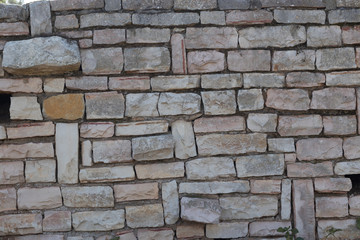 Stunning brick wall of Jerusalem stones in the beautiful garden near Herzl's cemetery. Jerusalem, Israel.