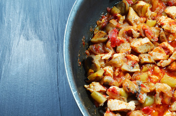 Sauteed chicken with mushrooms, tomatoes and onions.