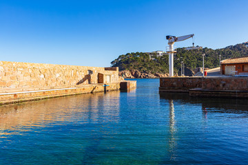 Naklejka premium View of the exit of the fishing port of Fornells, Begur, Costa Brava, Catalonia, Spain
