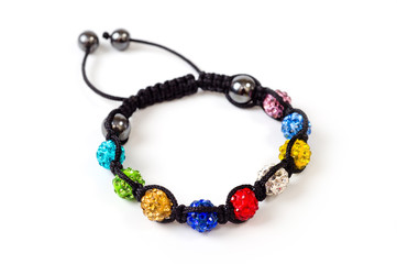 woven bracelet with multi-colored round beads on the arm