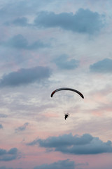 paramotor flight in vertical sunset sky