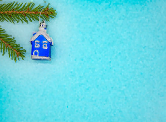 Fototapeta na wymiar Christmas decor and fir branches on a gentle blue background.