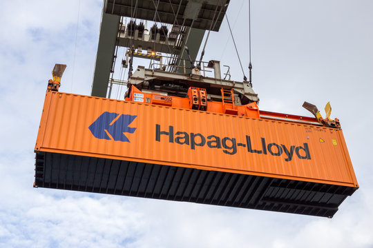 ROTTERDAM - SEP 6, 2015: Crane operator picking up a Hapag-Lloyd sea container in the Port of Rotterdam.