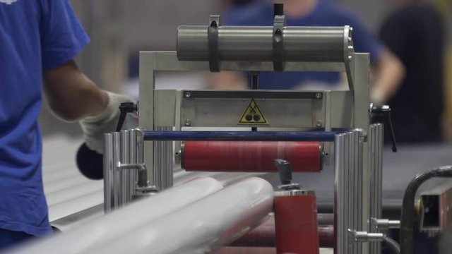 Automatic Aluminium extrusion production line in modern factory. Production of Complex lightweight extruded aluminium metal profiles, commonly used as material in construction and manufacturing