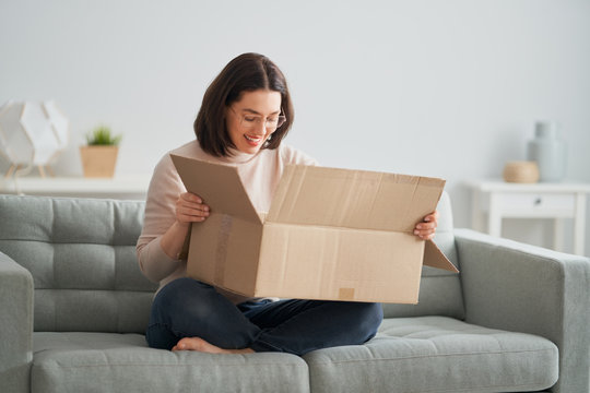 Woman Is Holding Cardboard Box