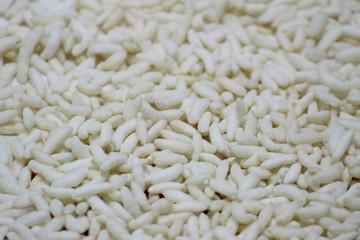Puffed rice on the white designed plate with white background