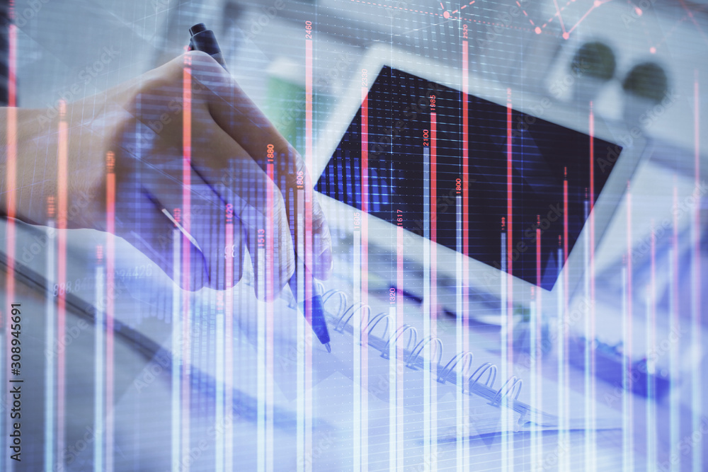 Wall mural financial forex graph drawn over hands taking notes background. concept of research. multi exposure