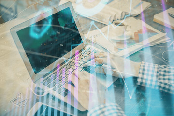 Double exposure of forex graph with man working on computer on background. Concept of market analysis.