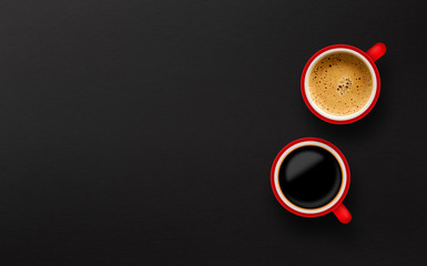 two red cup of coffee on black paper background. top view