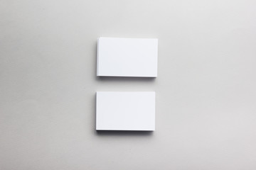 Business card blank on wooden background. Corporate Stationery, Branding Mock-up. Creative designer desk. Flat lay. Copy space for text