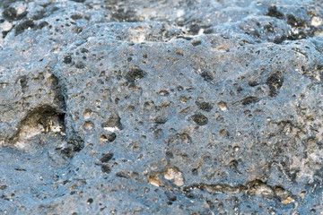 black volcanic rocks on beach