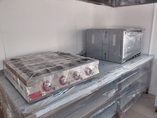 New packed chrome colored kitchen ware at canteen