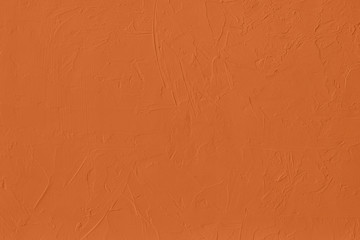 Saturated orange colored low contrast Concrete textured background with roughness and...