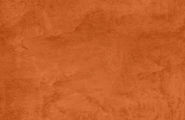 Saturated orange colored low contrast Concrete textured background with roughness and irregularities. 2020 color trend.
