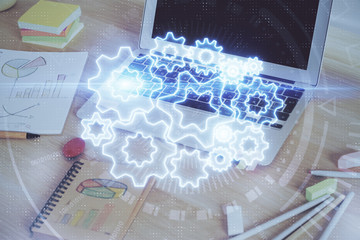 Multi exposure of business theme icons and work space with computer background. Concept of success.