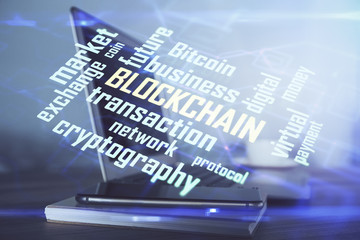 Multi exposure of blockchain theme hologram and table with computer background. Concept of bitcoin...