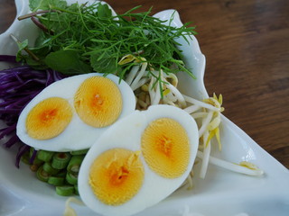 boiled eggs twin yolk with parsley on a plate