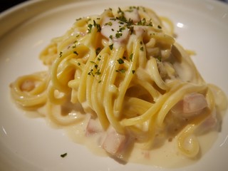 pasta with pesto sauce and basil