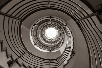 Fototapeta premium Modern spiral staircase in black and white, black and white photo, architecture photography