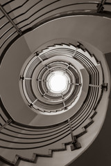 Fototapeta premium Modern spiral staircase in black and white, black and white photo, architecture photography