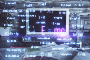 Desktop computer background and formula hologram writing. Double exposure. Education concept.