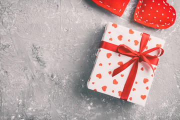 Valentine or other holiday handmade present in paper with red hearts and gifts box in holiday...