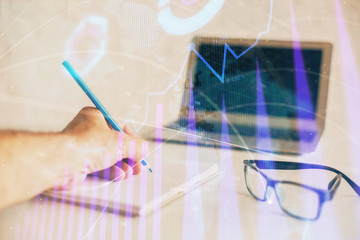 Multi exposure of man hands with stock market forex graph.