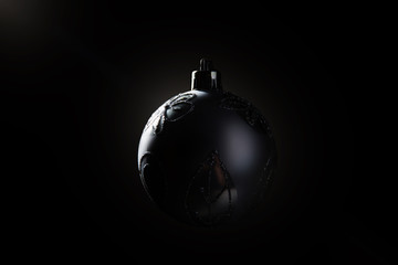 Silver Christmas bauble over dark background. Low key photo. Ball shape.