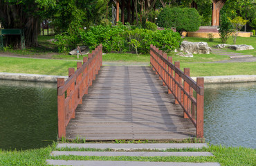 Wooden bridge in park or garden.