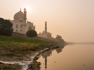 Fototapeta na wymiar Taj Mahal reflected in Yamuna river